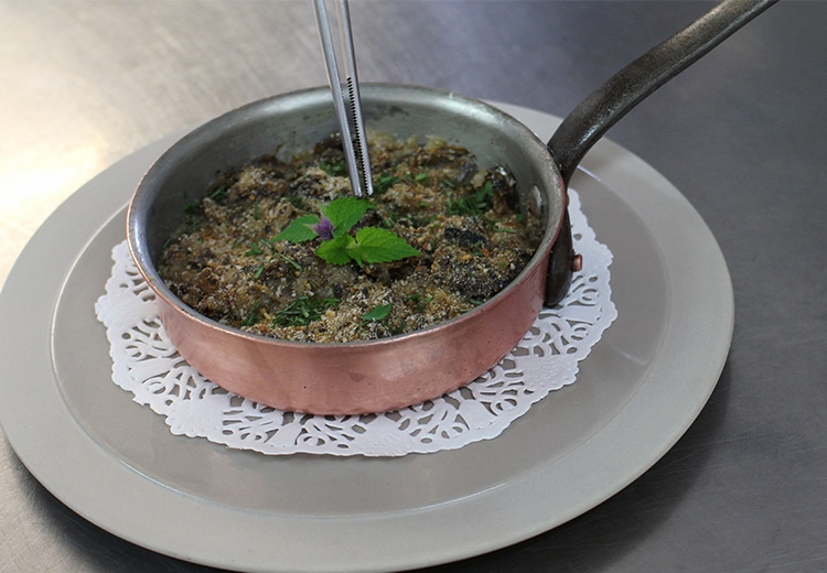 Snail and mushroom casserole with crème fraîche.